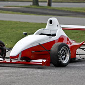 F1000 race car outside on a pavement track