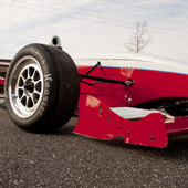 Ground-level view of the right side of the Philly Motor Sports F1000 race car and front wing - Formula B racing