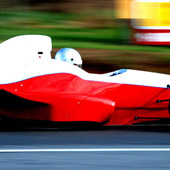 Right side view of the F1000 in motion on an outdoor track